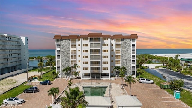 outdoor building at dusk featuring a water view