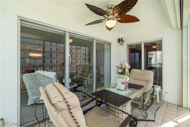 sunroom featuring ceiling fan