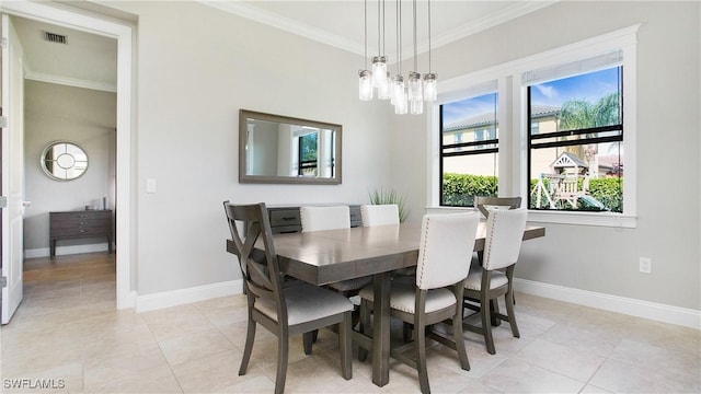 tiled dining space with a chandelier and ornamental molding