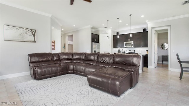 living room featuring ceiling fan, light tile patterned flooring, and ornamental molding