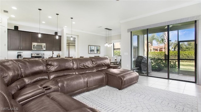 tiled living room featuring crown molding and a healthy amount of sunlight