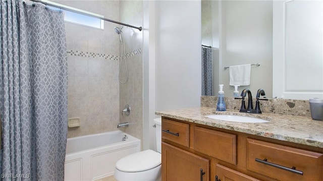 full bathroom featuring vanity, shower / bath combo, and toilet