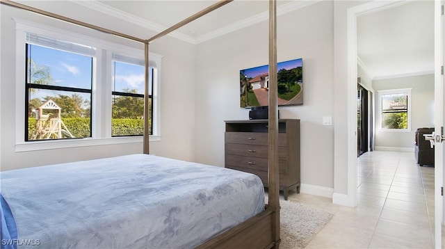 tiled bedroom with crown molding and multiple windows