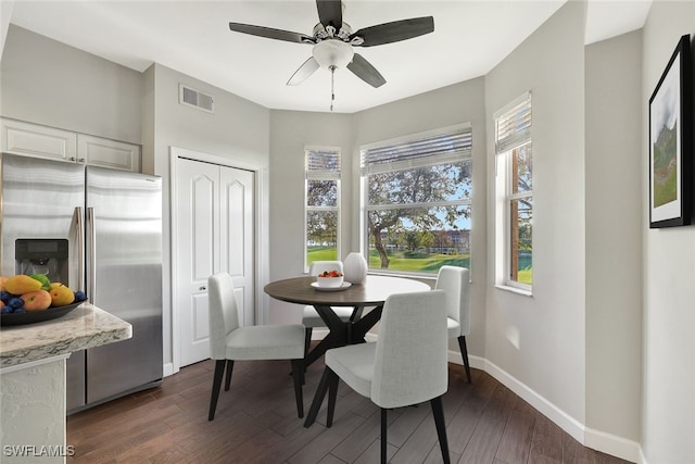 dining area featuring dark hardwood / wood-style flooring and ceiling fan