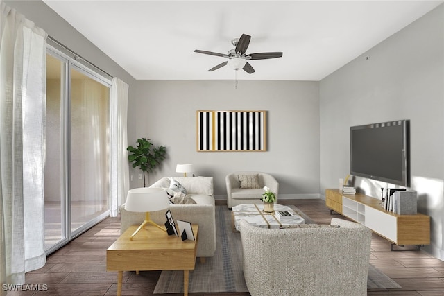 living room with ceiling fan and dark hardwood / wood-style flooring