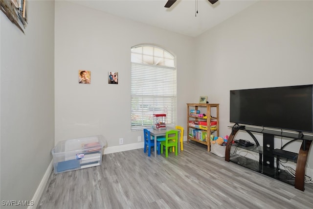 game room featuring light hardwood / wood-style floors and ceiling fan