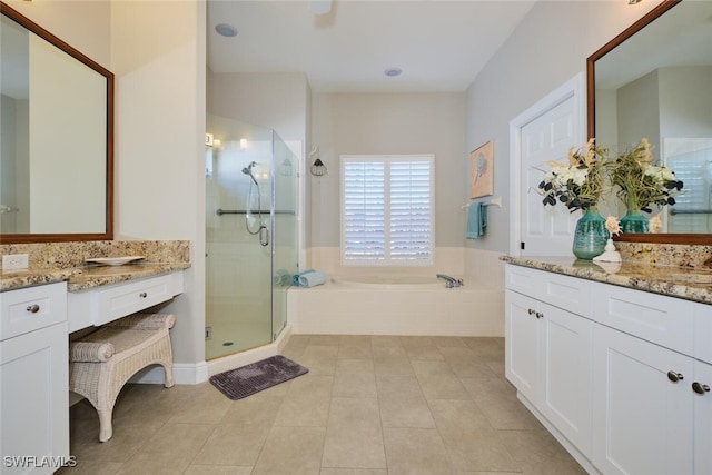 bathroom featuring tile patterned floors, vanity, and plus walk in shower