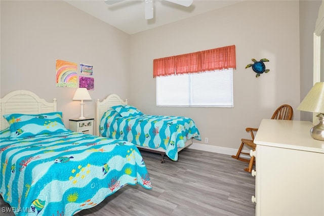 bedroom featuring hardwood / wood-style flooring and ceiling fan