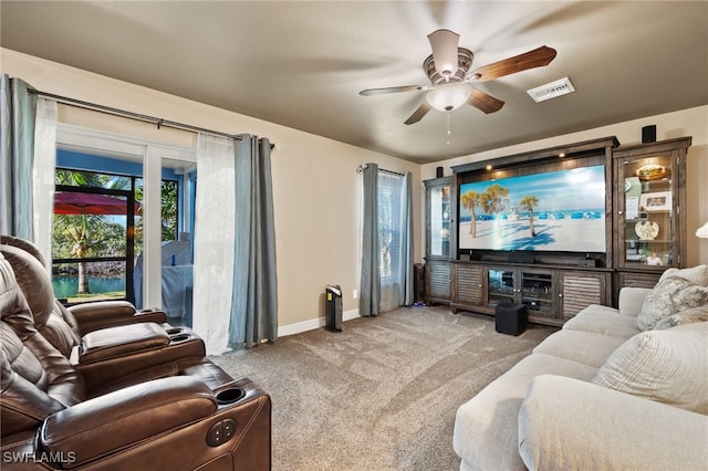 carpeted living room with ceiling fan