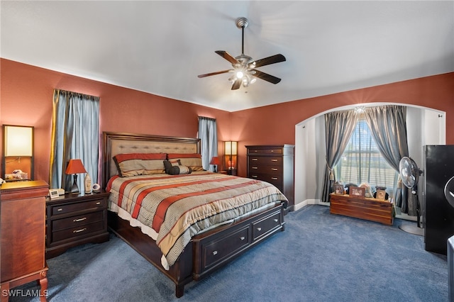 bedroom featuring dark carpet and ceiling fan