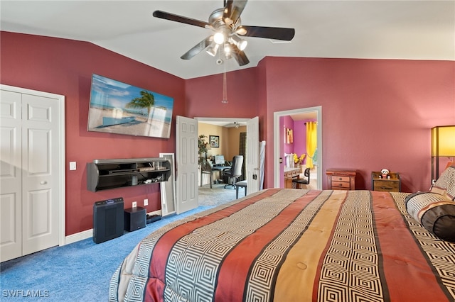 carpeted bedroom with ceiling fan, a closet, and vaulted ceiling