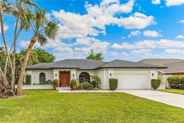 view of front of home with a garage and a front lawn