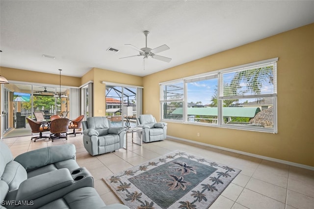 living room with light tile patterned floors and ceiling fan