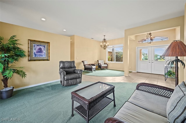 living room featuring french doors, light tile patterned floors, and an inviting chandelier