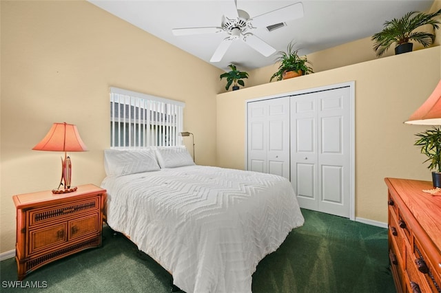 bedroom featuring dark colored carpet, a closet, and ceiling fan