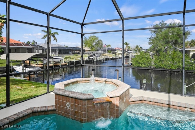 view of swimming pool featuring a lanai, pool water feature, a dock, an in ground hot tub, and a water view