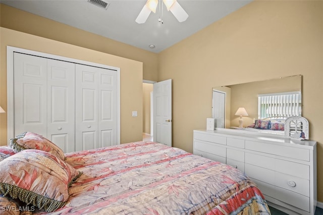 bedroom featuring ceiling fan and a closet