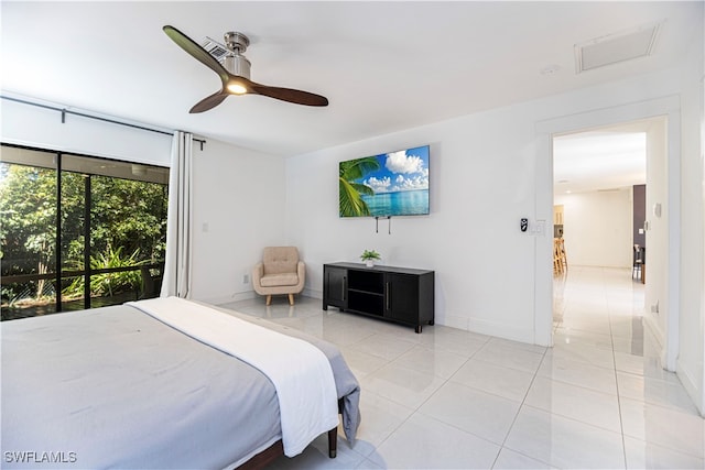 tiled bedroom featuring ceiling fan