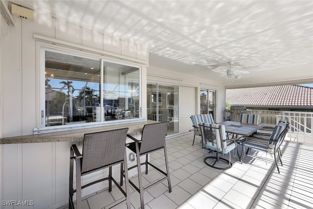 view of patio featuring ceiling fan