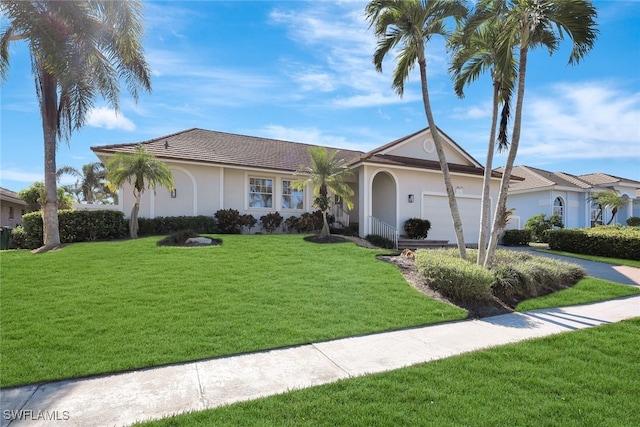 ranch-style house featuring a garage and a front yard