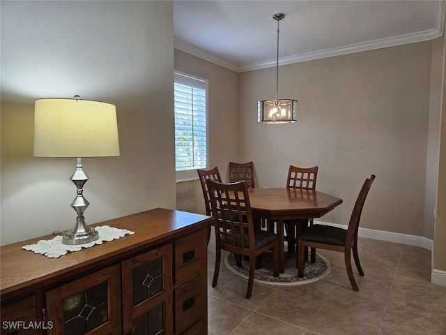 dining room with tile patterned floors and crown molding