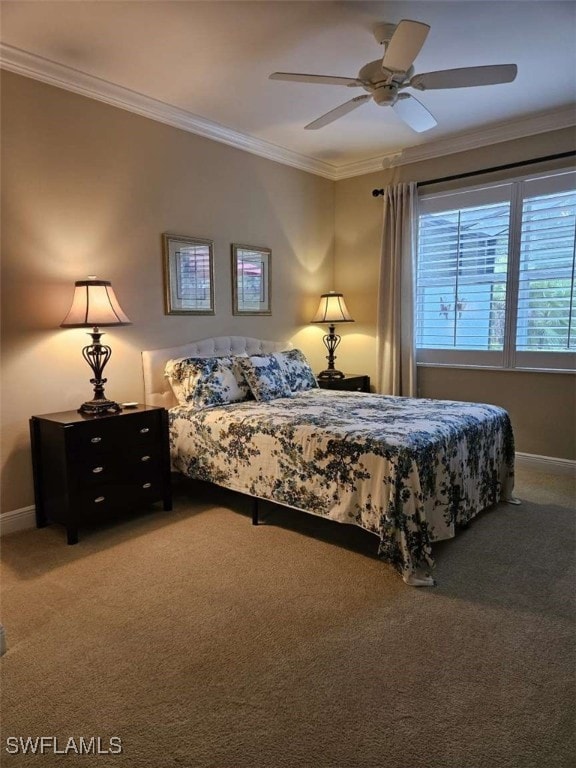 carpeted bedroom with ceiling fan and ornamental molding