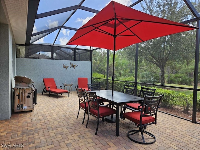 view of patio featuring a lanai and a grill