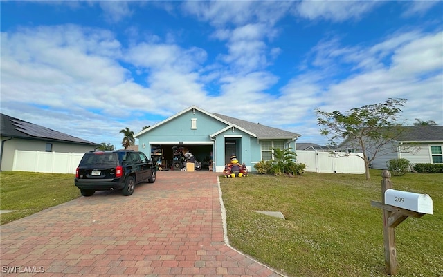 view of front facade featuring a garage and a front yard