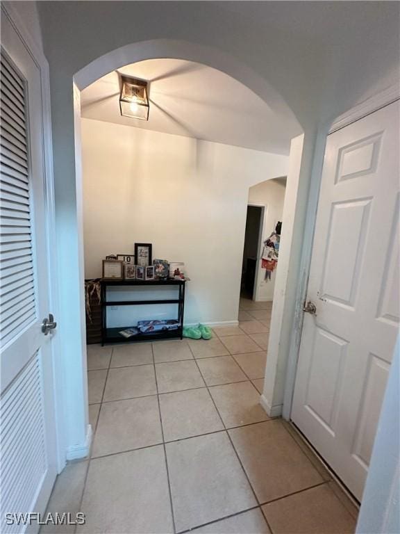 hallway with light tile patterned floors