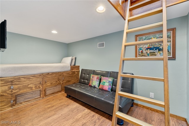 bedroom with light hardwood / wood-style floors