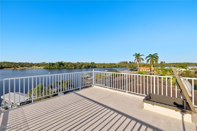 wooden deck featuring a water view