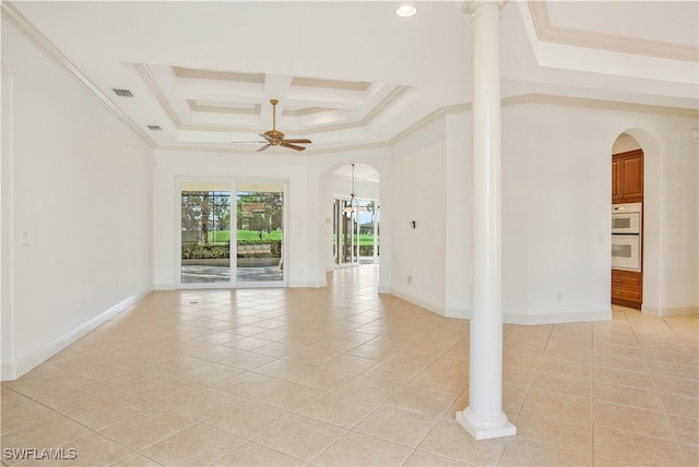 unfurnished room featuring a tray ceiling, ceiling fan, crown molding, and light tile patterned flooring