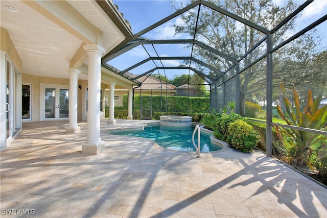 view of pool featuring glass enclosure, an in ground hot tub, french doors, and a patio