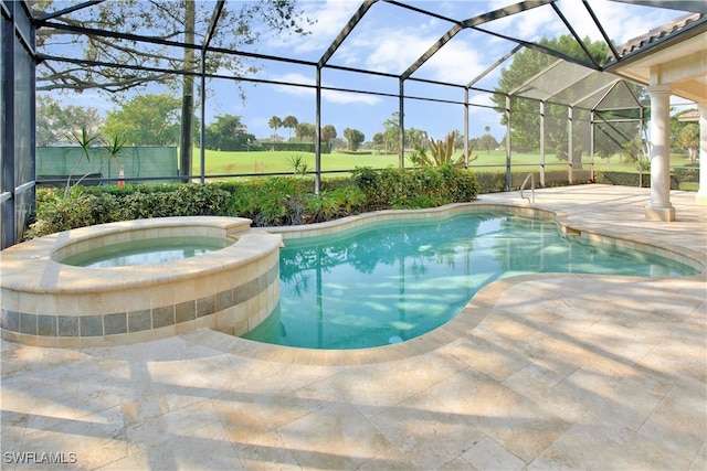 view of pool with an in ground hot tub, a patio, and a lanai