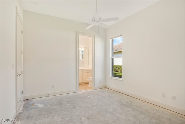 unfurnished bedroom with ceiling fan and ensuite bathroom