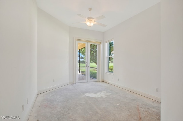 spare room with ceiling fan and french doors