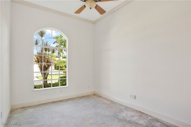 spare room featuring crown molding and ceiling fan