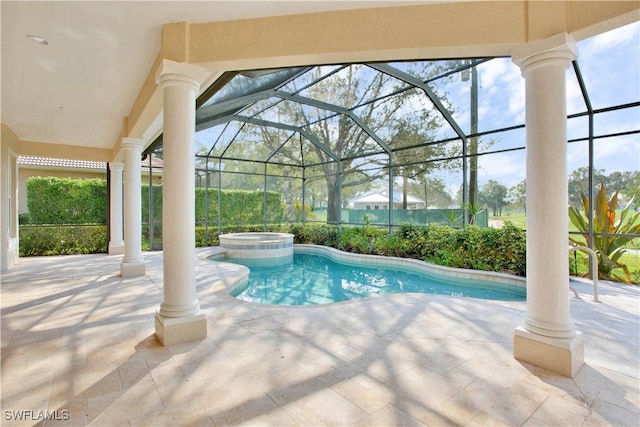 view of pool featuring an in ground hot tub, a patio area, and a lanai