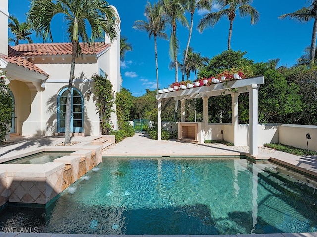 view of swimming pool with a pergola and an in ground hot tub