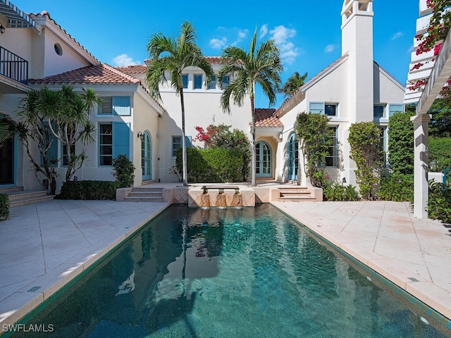 view of swimming pool with a patio