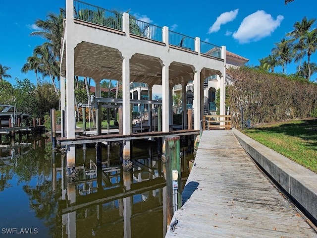 dock area with a water view