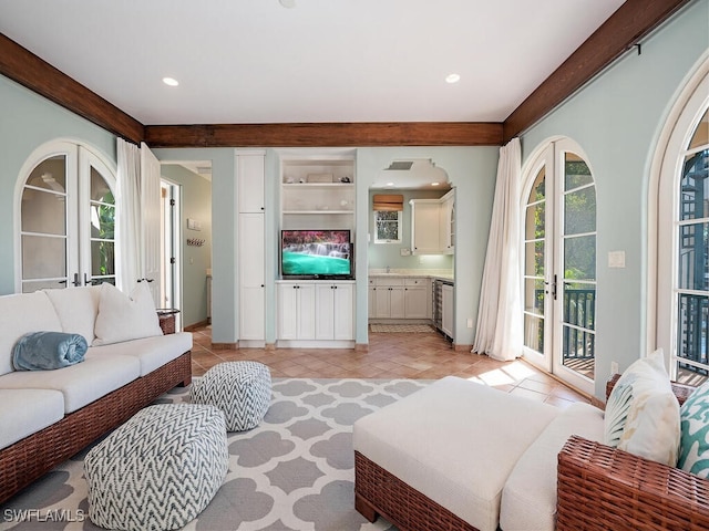 tiled living room featuring french doors