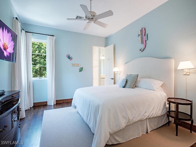 bedroom with ceiling fan and dark wood-type flooring