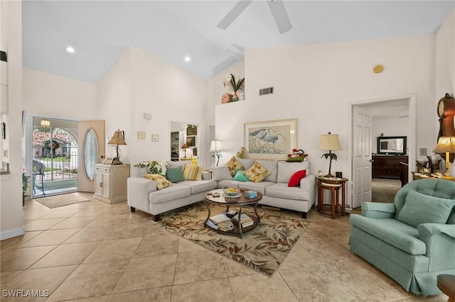 living room featuring high vaulted ceiling, ceiling fan, and light tile patterned flooring