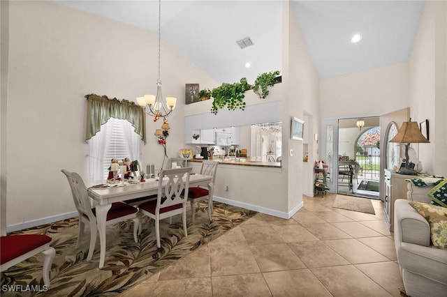 dining space featuring light tile patterned floors, high vaulted ceiling, and a notable chandelier