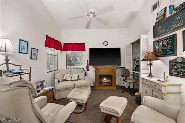 carpeted living room with ceiling fan