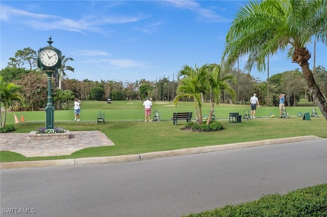 view of home's community featuring a lawn