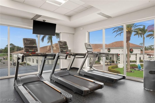 workout area featuring a drop ceiling