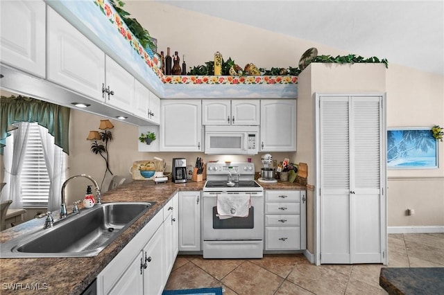 kitchen with white cabinets, white appliances, sink, and light tile patterned floors