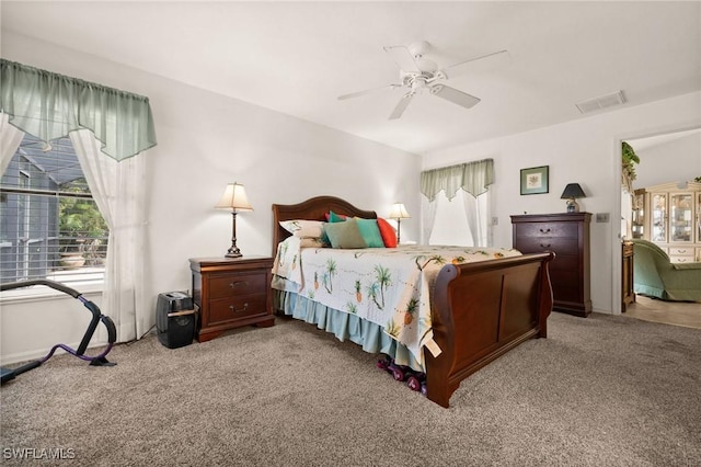 carpeted bedroom with ceiling fan